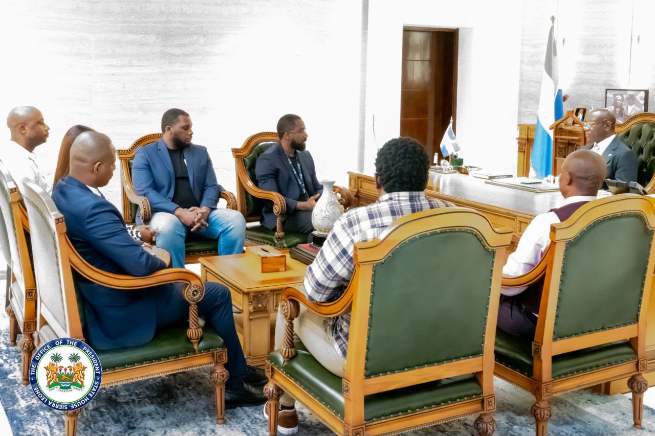 The visiting delegation meets with President Bio around his desk at State House.